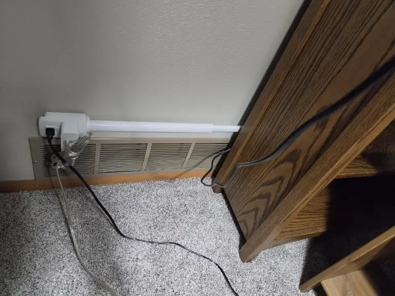 Socketify track run behind a bookshelf